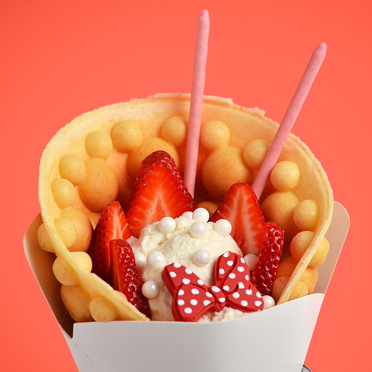 Disney Mickey Mouse Rotating Bubble Waffle Maker bubble waffle cone filled with berries and Minnie Mouse chocolate bows MIC-66 Select Brands