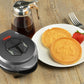 Star Wars The Mandalorian 4" mini waffle maker lifestyle image with waffles and syrup LSW-46M Select Brands